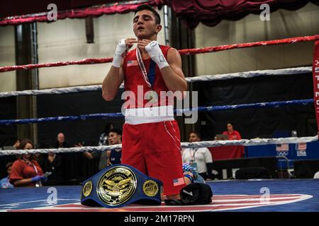 Lubbock, TX, USA. 10th Dec, 2022. Julius Ballo, of San Diego, CA (red) kneels in prayer after being declared the winner following his Elite Male 125lb championship bout. (Credit Image: © Adam DelGiudice/ZUMA Press Wire) Credit: ZUMA Press, Inc./Alamy Live News Stock Photo