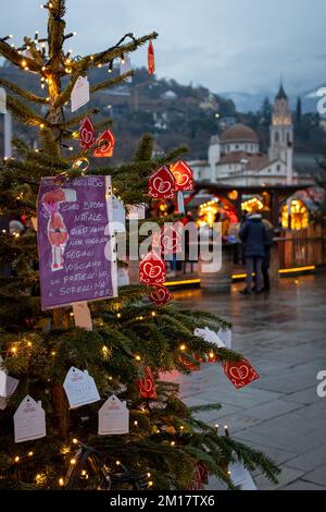 Meran, South Tyrol, Italy 02 December 2022 People shopping  at traditional famous christmas market (Christkindlmarkt) at Merano Stock Photo