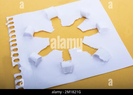 Sun shape made through torn paper in white background Stock Photo - Alamy