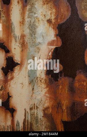 Close up of heavily rusted metal surface with peeling paint, corrosion texture and brown iron spots Stock Photo
