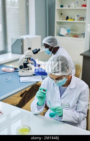 Vertical shot of medical laboratory with two scientists working on research Stock Photo