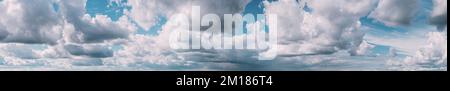 Panorama Of Cloudy Sky. Natural Day Cloudy Sky Abstract Background. Panorama Panoramic View. Backdrop. Copy Space. Bright Blue Stock Photo