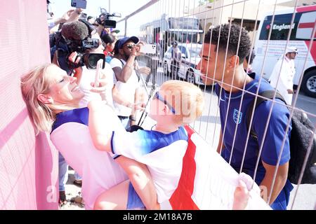 England's Jude Bellingham takes photos with fans outside the Souq Al-Wakra hotel, Qatar, following England's loss to France in their World Cup quarter-final in Al Khor on Saturday.Picture date: Sunday December 11, 2022. Stock Photo