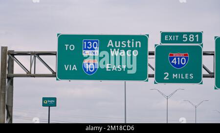 Direction signs to Austin and Waco on the highway Stock Photo