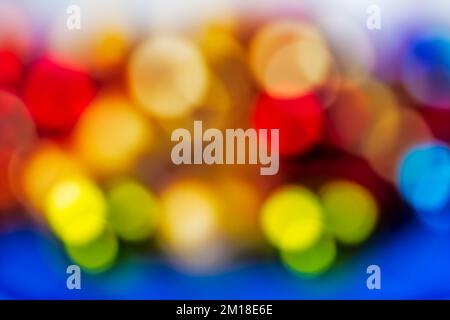 Abstract defocused glowing christmas ornaments background Stock Photo