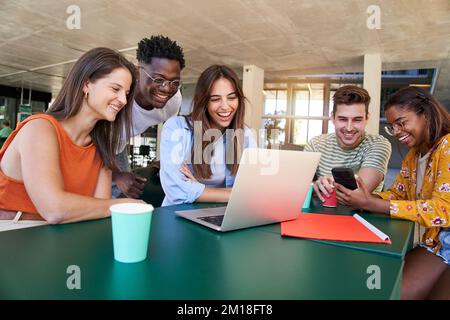 Group of students, high school pupils gather in college cafeteria, discuss topics, work together Stock Photo
