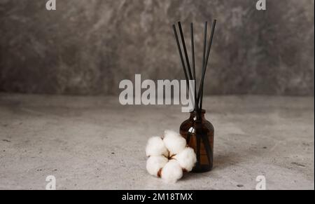 Aroma diffuser with cotton. Aromatherapy on a dark marble background. Stock Photo