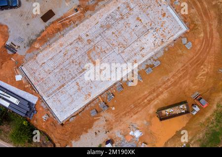 Process of installing reinforcement steel bars for concrete foundations at construction site Stock Photo