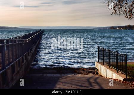 Skaneateles Pier and boat launch  on Skaneateles Lake in the Finger Lakes Region of upstate New York on a cold autumn morning Stock Photo