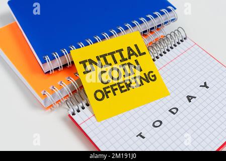 Hand writing sign Initial Coin Offering. Word for Is a type of crowd funding using crypto currencies Stock Photo