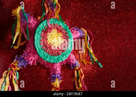 Mexican Pinata used in posadas and birthdays on red background Stock Photo