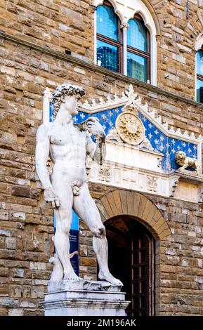 The marble replica of Michelangelo's David in Piazza della Signoria square in front of Palazzo Vecchio palace, Florence city center, Tuscany, Italy Stock Photo
