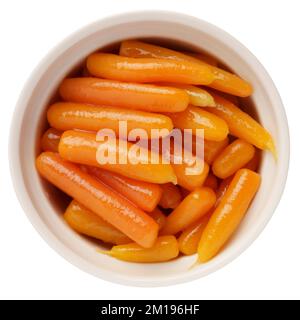 Boiled canned carrots in a bowl isolated on white background. View from above Stock Photo