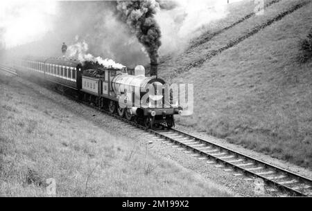 Location filming in England of Train Sequence featuring the Stunt Double for TERRY-THOMAS for THOSE MAGNIFICENT MEN IN THEIR FLYING MACHINES 1965 director KEN ANNAKIN music Ron Goodwin costume design Osbert Lancaster Twentieth Century Fox Productions Stock Photo