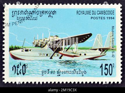 Cancelled postage stamp printed by Cambodia, that shows Airplane Sikorsky S-42, circa 1994. Stock Photo