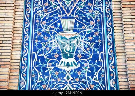 Traditional uzbek pattern on the ceramic tile on the wall of the mosque. Stock Photo