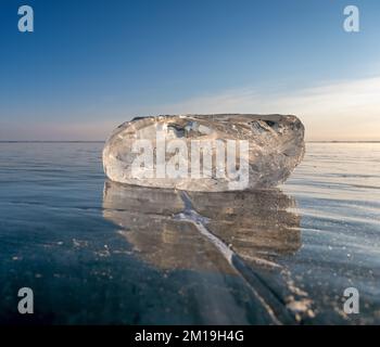 Sunlight refracted in piece of ice Stock Photo