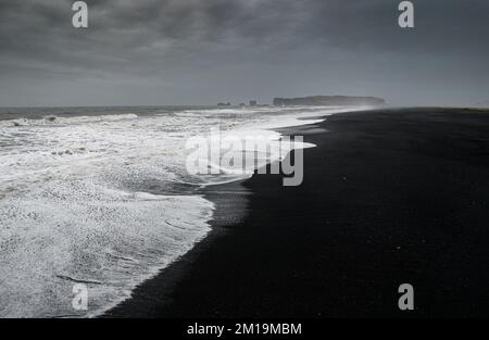 Dramatic coast landscape from drone aerial view of waves crashing on a reynisfjara black beach Reynisfjara, Vik and Myrdal in Golden Circle in Iceland Stock Photo
