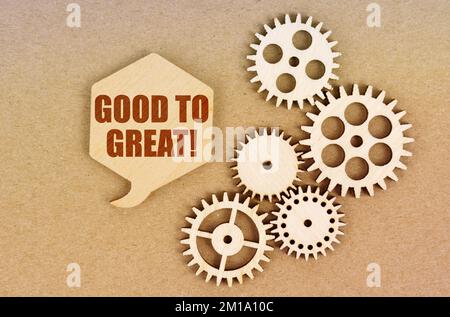 Business and economics concept. On a paper background, gears and a thought plate with the inscription - Good To Great Stock Photo