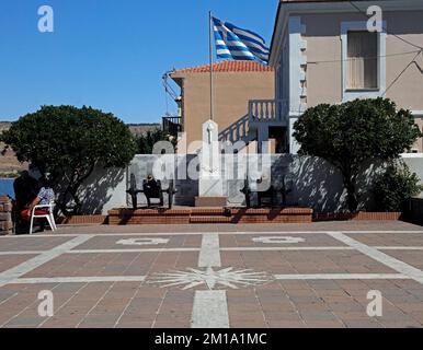 Decorative terrace and war memorial with canons and Greek flag, Petra, Lesbos. Taken September / October 2022. Stock Photo