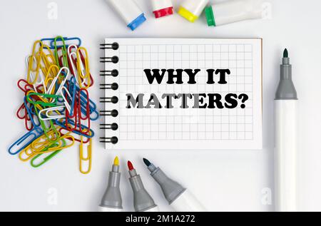 Business and finance concept. On the table are markers, paper clips and a notebook with the inscription - Why It Matters Stock Photo
