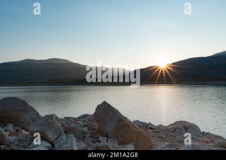 Sun Slipping Behind the Distant Hills at Joe's Valley Reservoir in Utah, a Destination for many Rock Climbers Stock Photo