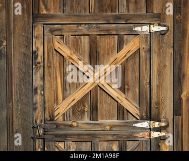 X pattern on old weathered wooden door in Midland, South Dakota Stock Photo