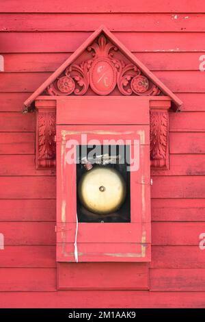 Close up of a fire station bell on wooden wall of fire department building in Midland, South Dakota Stock Photo