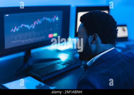 Financial analyst working on stock exchange market in modern office - Fintech concept Stock Photo