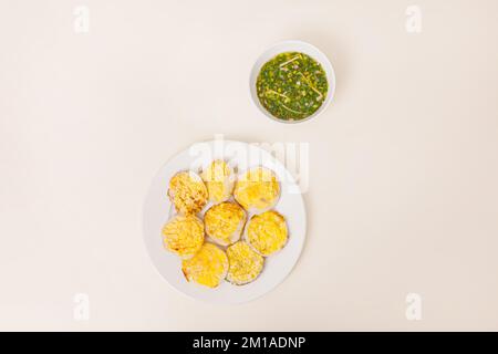 Banh can, Vietnamese mini pancake with with rice batter and egg, vietnamese food isolated on white background, top view Stock Photo