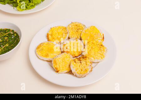 Banh can, Vietnamese mini pancake with with rice batter and egg, vietnamese food isolated on white background, close-up Stock Photo