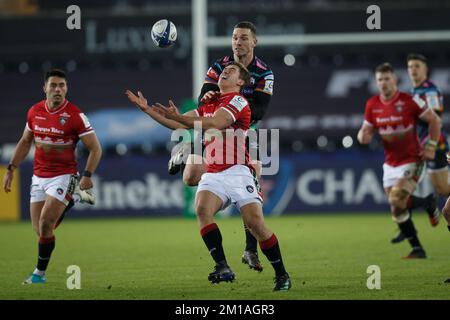 Swansea, UK. 11th Dec, 2022. George North of Ospreys and Joe Heyes of Leicester compete for the ball during the Ospreys v Leicester Champions Cup rugby match. Credit: Gruffydd Thomas/Alamy Live News Stock Photo