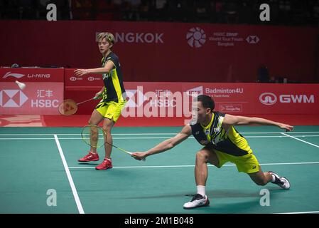 Bangkok, Thailand. 11th Dec, 2022. Dechapol Puavaranukroh (R) and Sapsiree Taerattanachai (L) of Thailand play against Zheng Si Wei and Huang Ya Qiong of China during the Badminton Mixed double Final match in the HSBC BWF World Tour Finals 2022 at Nimibutr Stadium. Zheng Si Wei and Huang Ya Qiong won over Dechapol Puavaranukroh and Sapsiree Taerattanachai 2-1 (21-19, 18-21, 21-13). Credit: SOPA Images Limited/Alamy Live News Stock Photo