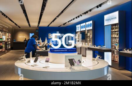 Mobile phone, smartphone with 5 G wireless high speed internet shop. Creative big letters 5G.Modern technology concept-Surrey BC Canada-December 8,202 Stock Photo