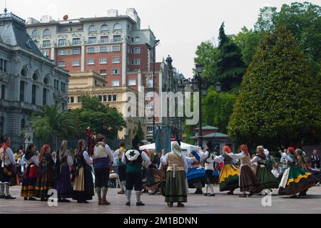 Oviedo, Spain; 05292011: Big group of people with traditional asturian clothes, bigpipes and drums, celebrating Martes de Campo at Escandalera square. Stock Photo