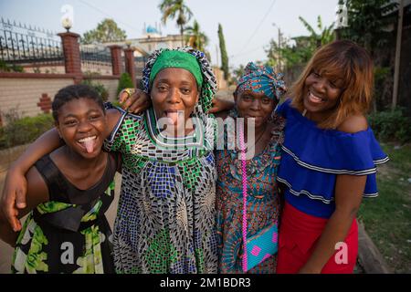 Four african women of different ages together laugh and make funny faces Stock Photo