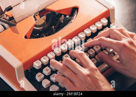 Hands typing on a retro typewriter. Business concepts. Retro picture style. Archive Stock Photo