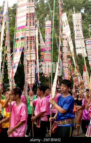 Many pretty woman on traditional dance in Tak Bat Dok Mai Festival is Ceremony of Wat Phra Buddhabat Woramahaviharn temple in Saraburi , Thailand. Stock Photo
