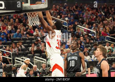 Orlando, Florida, USA, December 11, 2022, Toronto Raptors forward Christian Koloko #35 makes a dunk against the Magic at the Amway Center. (Photo Credit: Marty Jean-Louis/Alamy Live News Stock Photo