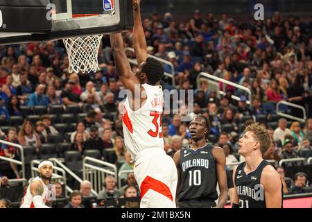 Orlando, Florida, USA, December 11, 2022, Toronto Raptors forward Christian Koloko #35 makes a dunk against the Magic at the Amway Center. (Photo Credit: Marty Jean-Louis/Alamy Live News Stock Photo