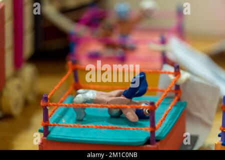 men toy wrestlers mexican tradition in a wrestling ring Stock Photo