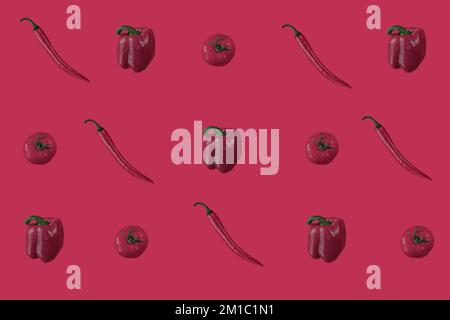 Vibrant red vegetables pattern on a red trendy background. Flat lay. Color of the year concept. Stock Photo
