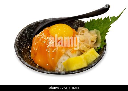 Die cut of Japanese rice bowl with sliced salmon sashimi Soft-boiled eggs on white isolated. Stock Photo