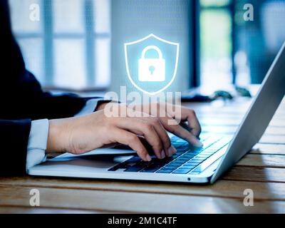 Cyber security system technology and protect concepts. Glowing digital secure padlock virtual icon on binary code with laptop computer while business Stock Photo