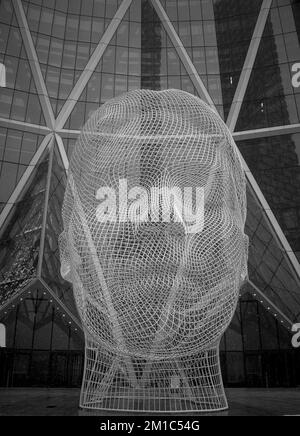 Calgary, Alberta / Canada - December 27 2022: Wonderland Sculpture by Jaume Plensa under the snow Stock Photo