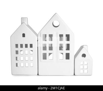 Candle holders in shape of houses on white background Stock Photo - Alamy