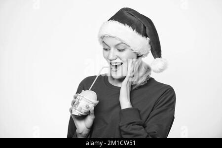 Girl with lemon and money. Lemon money concept. Girl santa hat drink juice lemon wrapped in banknote. Totally natural lemon juice. Fresh lemonade Stock Photo