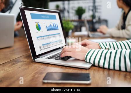young woman analyzing financial data in a coworking center . Stock Photo