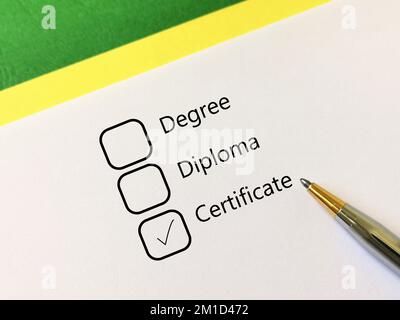 One person is answering question about human resources. He chooses certificate courses. Stock Photo