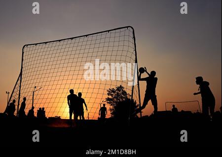 Beach soccer at sunset at Katara Beach Doha Stock Photo